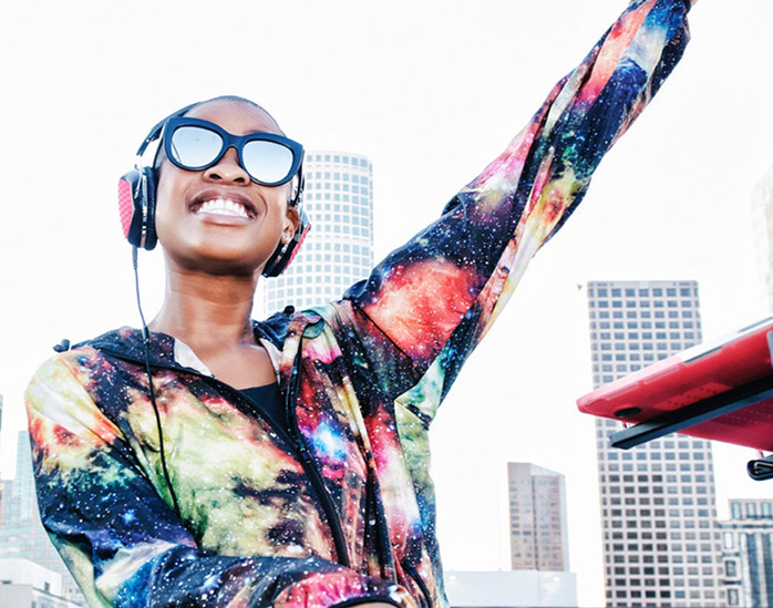 disc jockey smiling with sunglasses on
