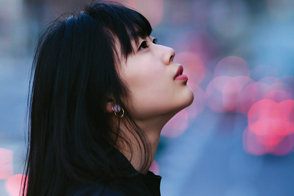 Woman looking up to the sky