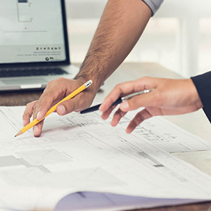 people looking at drawings