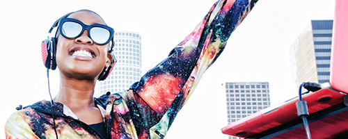 disc jockey smiling with sunglasses on