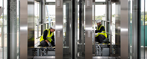 Otis mechanics working on an elevator