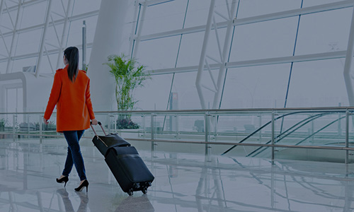 Woman walking through airport